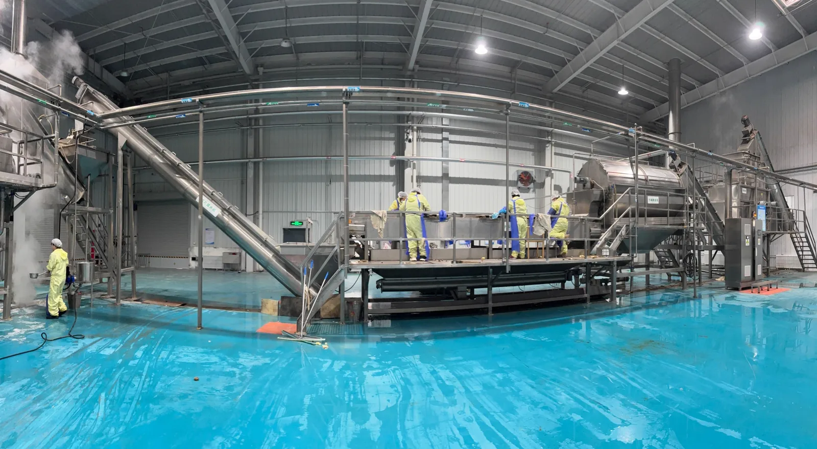 Potato processing factory floor at Junsheng, China - production lines for food-grade potato flakes and granules